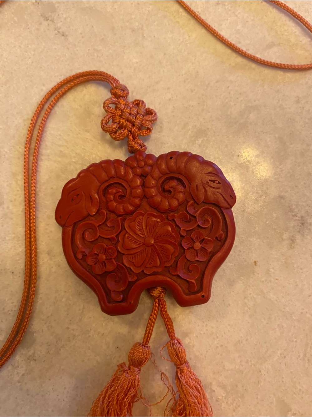 Cinnabar carved medallion